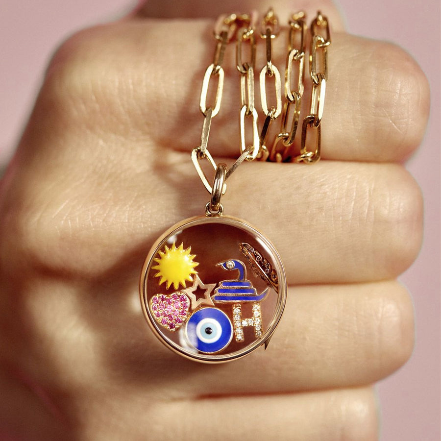 Loquet Turkish Eye Charm - Charms & Pendants - Broken English Jewelry in locket in hand