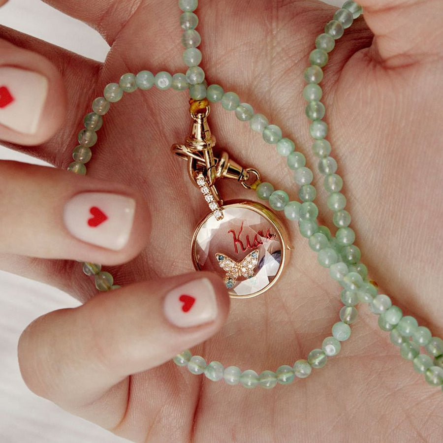 Loquet Butterfly Beauty Charm - Charms & Pendants - Broken English Jewelry in locket in hand